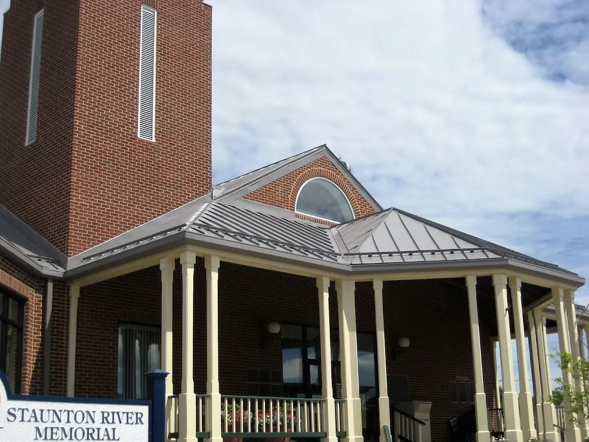 Skilled roofing craftsmen working on a residential roof in Hamilton